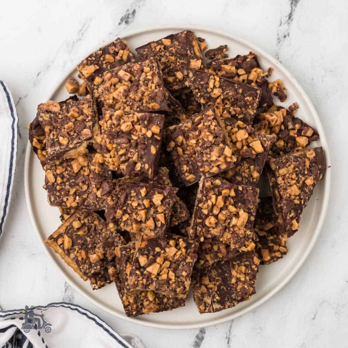 A dessert plate covered with a simple recipe of saltine crackers made into chocolate toffee.