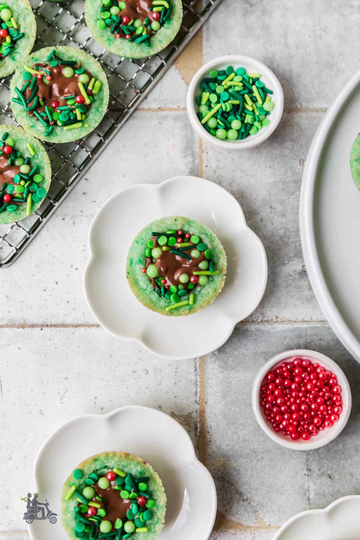Overhead view of a Sugar Cookie Wreath with Reese's cups and decorated with red and green sprinkles. 