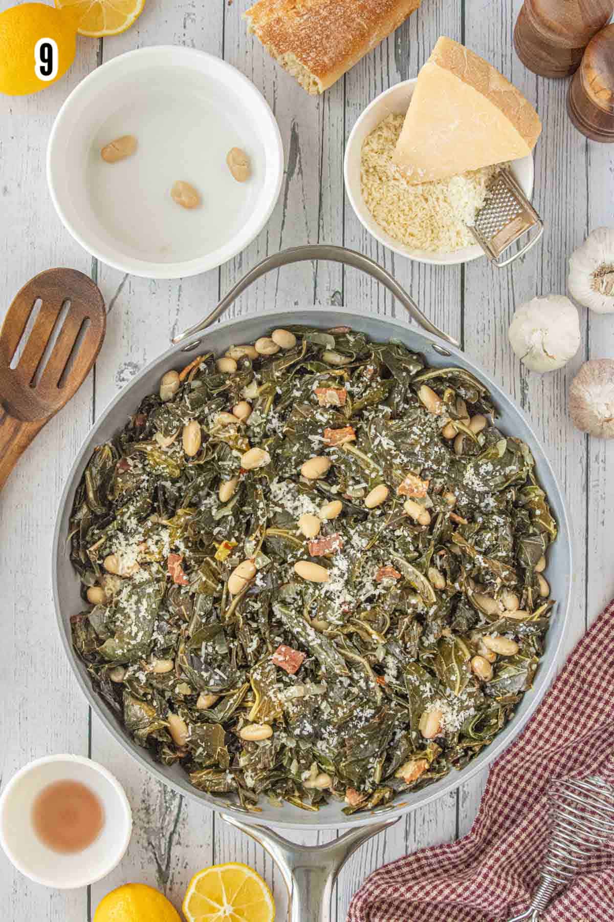 The completed Southern Collard Greens with Bacon and Beans recipe with a final sprinkle of grated Pecorino Romano cheese.