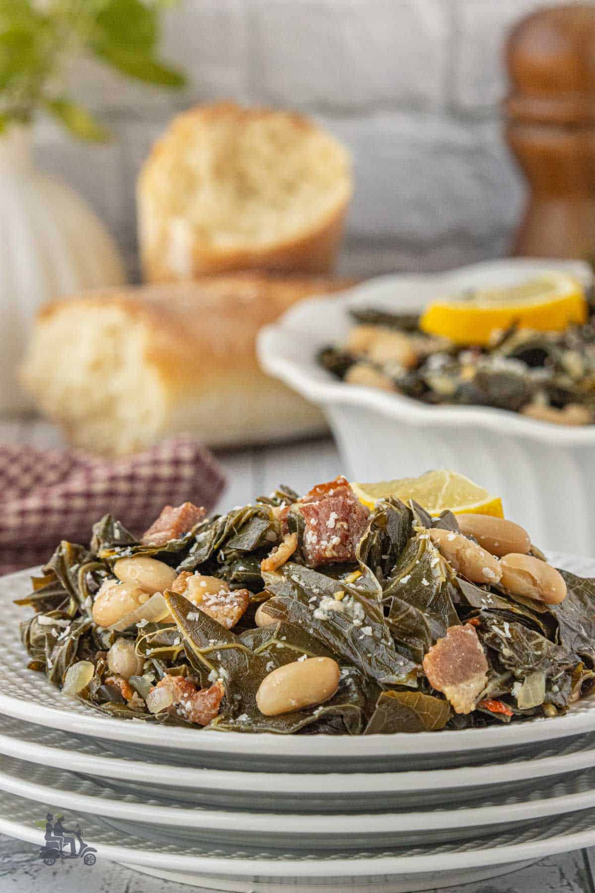 Tuscan style collard greens with cannellini beans piled on a plate.