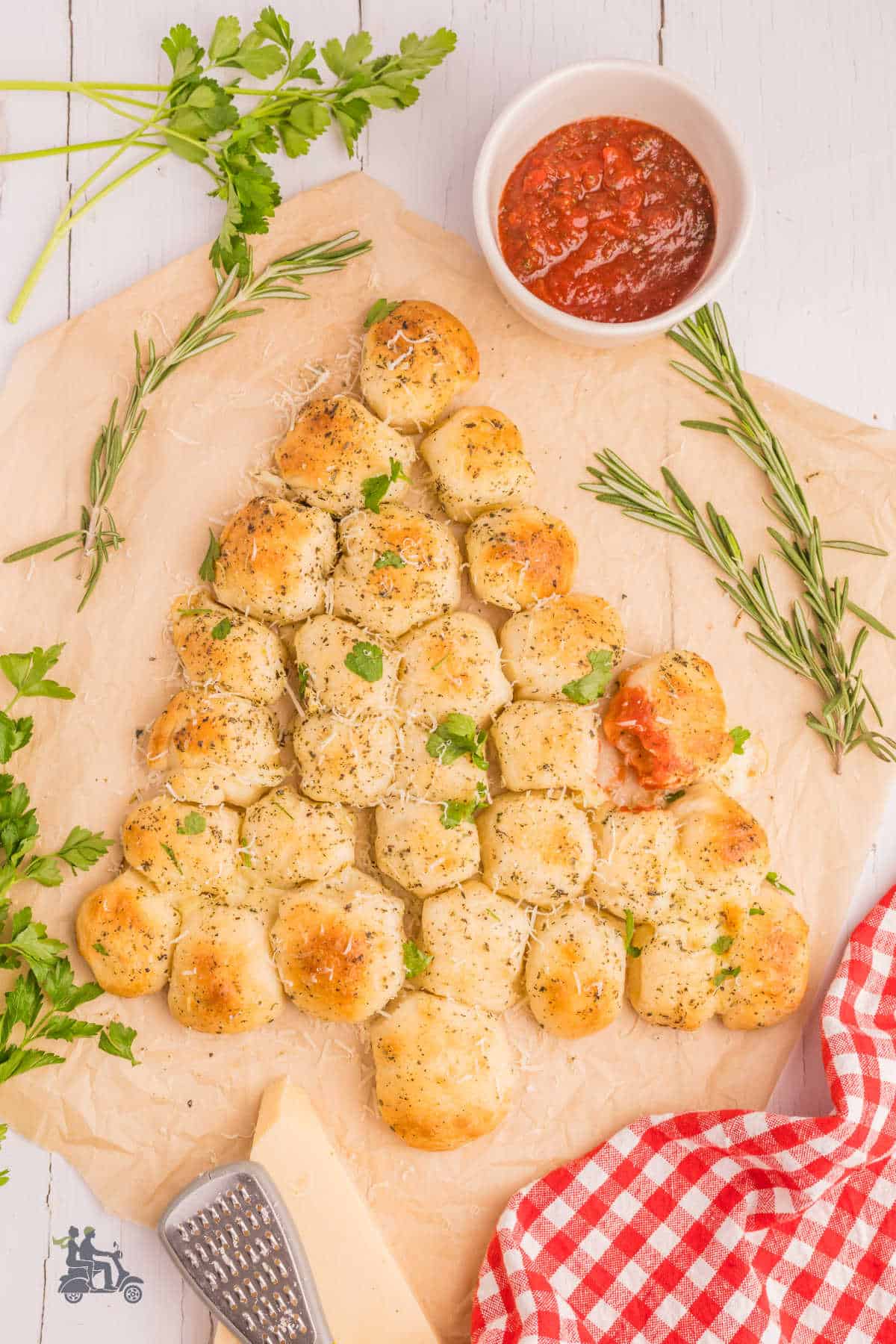 Pizza dough made to form cheese-stuffed rolls in the shape of a Christmas tree made as a side or appetizer during the holidays.