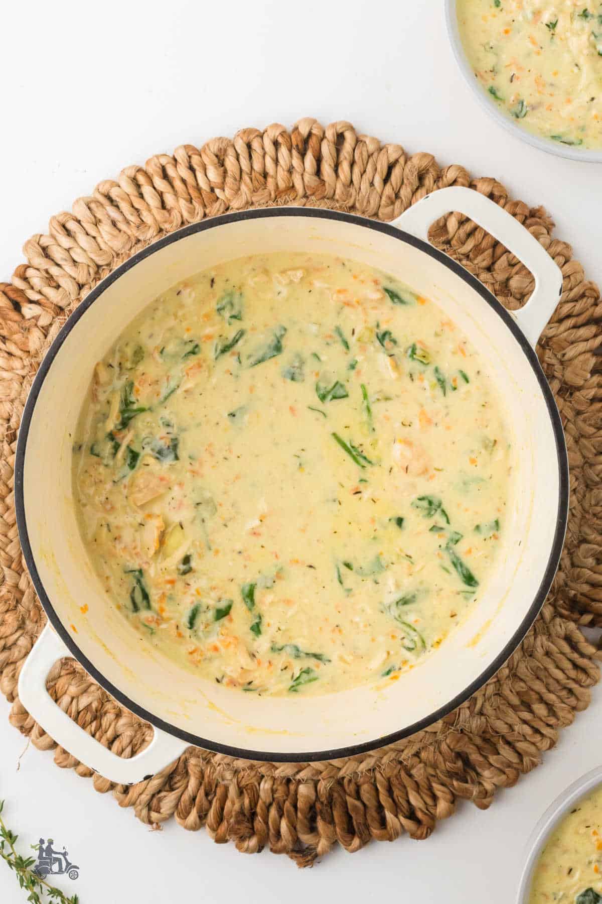 Overhead view of the Dutch Oven filled with the creamy chicken gnocchi soup.