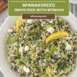 Overhead view of the Greek rice with Spinach and lemon shown in a white bowl.