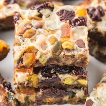 Holiday Magic Bars made with pistachios, dried cherries, espresso, and a gingersnap crust.