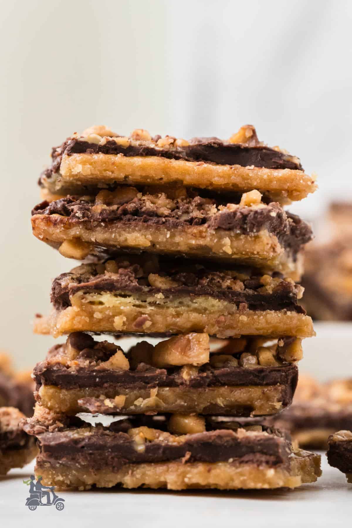A stack of saltine toffee bark made with toffee chocolate chips.