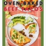 Overhead view of a white plate with a serving of beef tacos with a drizzle of lime avocado sauce.