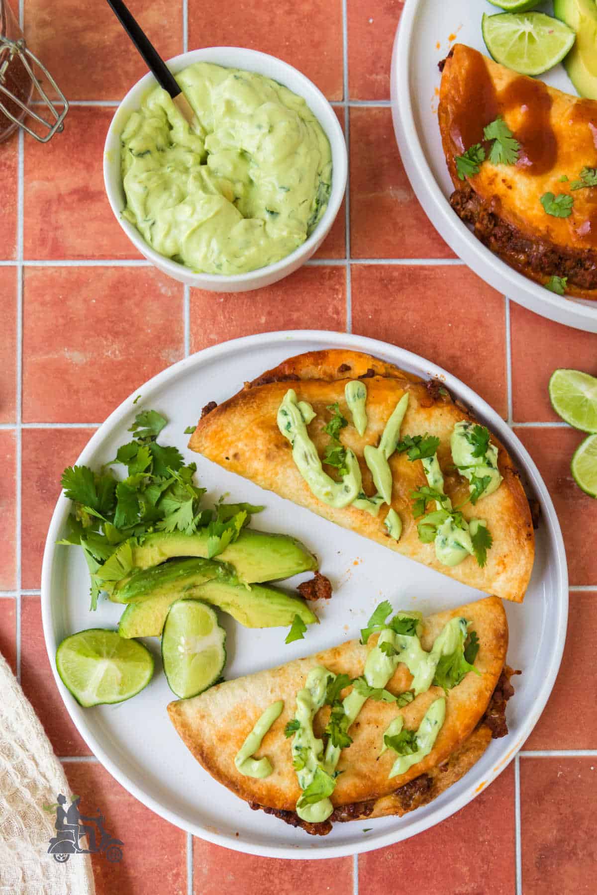 Crispy Beef Tacos with Lime Cilantro cream sauce are served for a family favorite taco night.