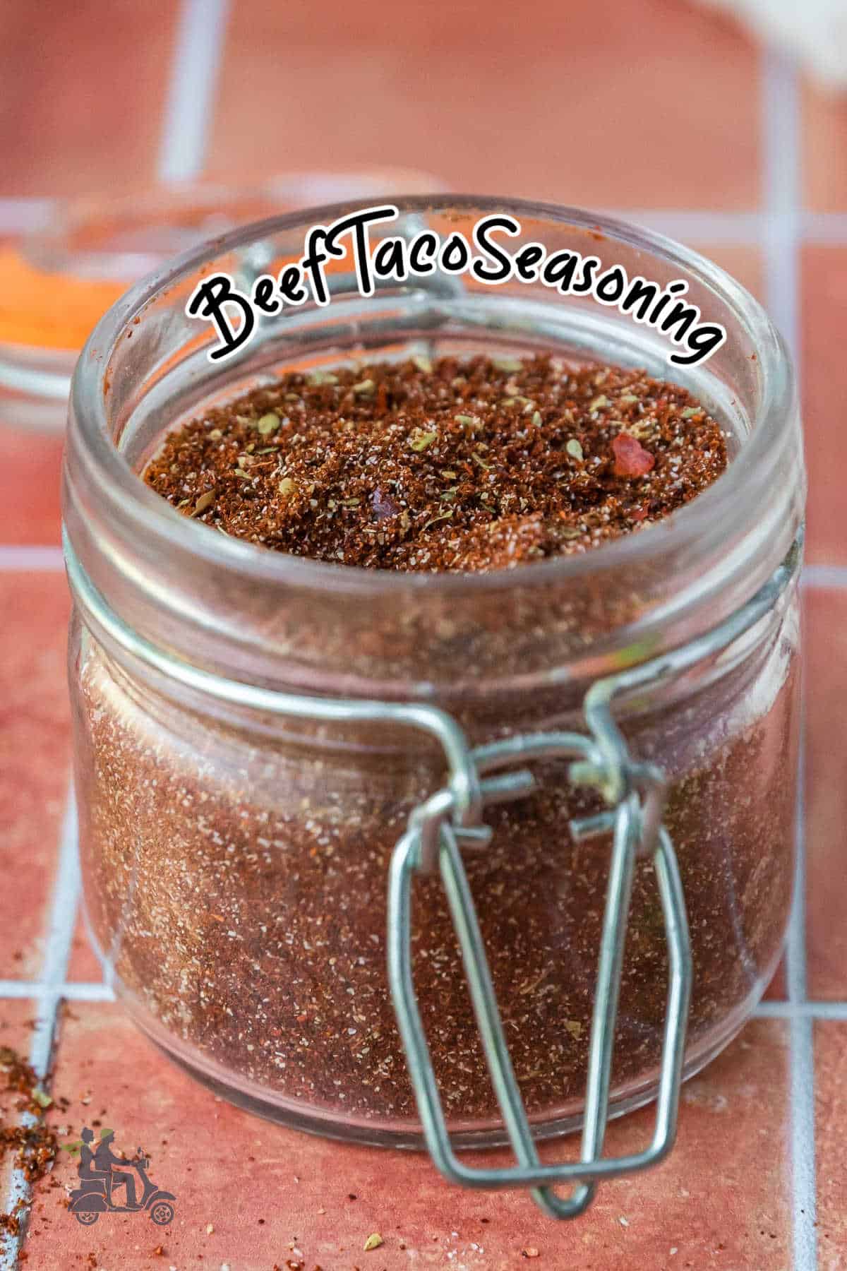A jar of Beef Taco Spice Mix with a title on the jar. 