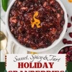 Cranberry Orange relish in a white bowl with a ribbon of orange zest on top.