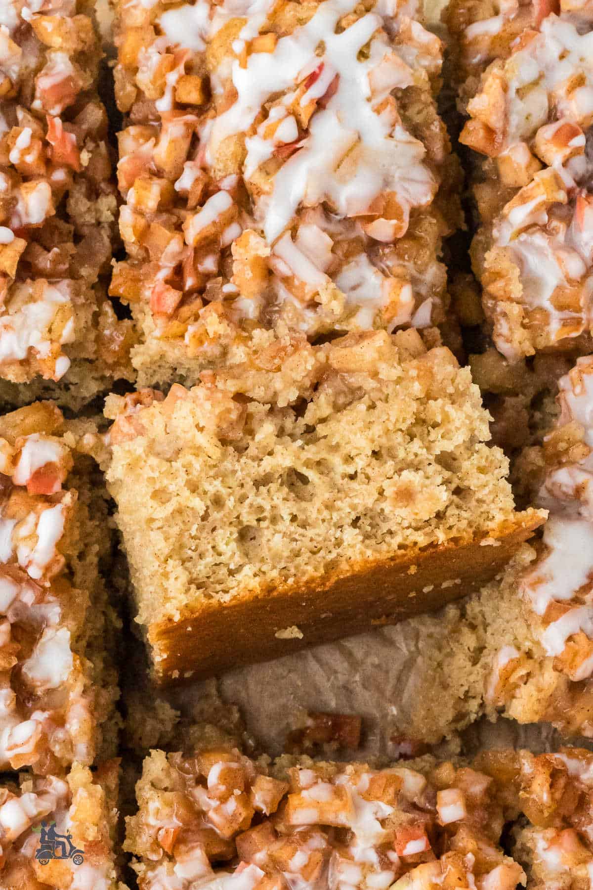 Close-up of the apple fritter cake with brown sugar and apple pie spice.