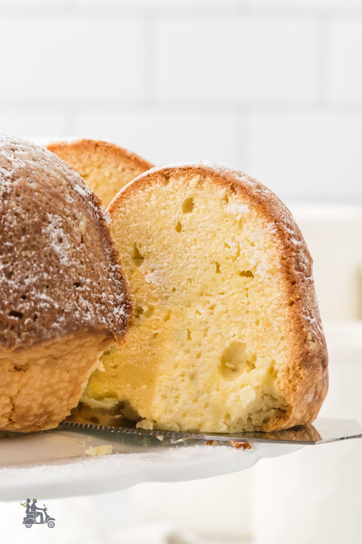 A slice from the homemade Irish Cake Dessert that's served on a cake pedestal.