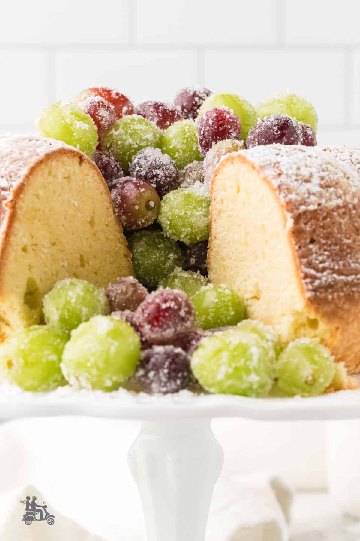 Butter cake with a cream cheese crumb and served without frosting, and wine-marinated frosted grapes instead.