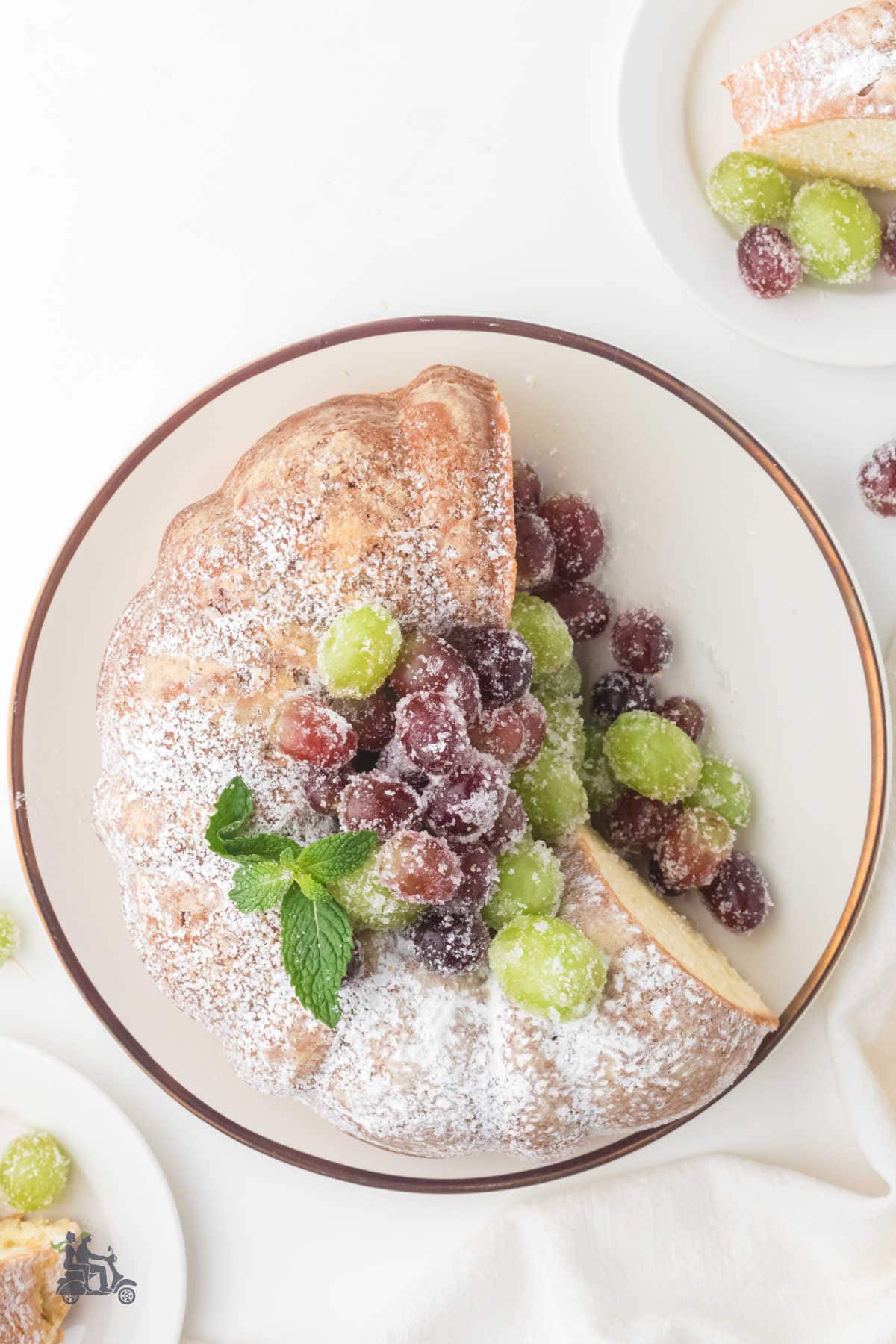 Overhead view of the Old-fashioned Irish Butter Bundt Cake with the sugared wine-marinated grapes.