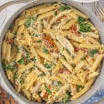 Close-up of creamy sun-dried tomato chicken pasta.