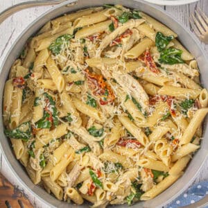 Close-up of creamy sun-dried tomato chicken pasta.