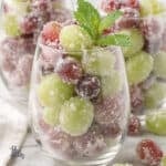 Wine Prosecco macerated grapes and rolled in sugar, piled in a stemmed wine glass.