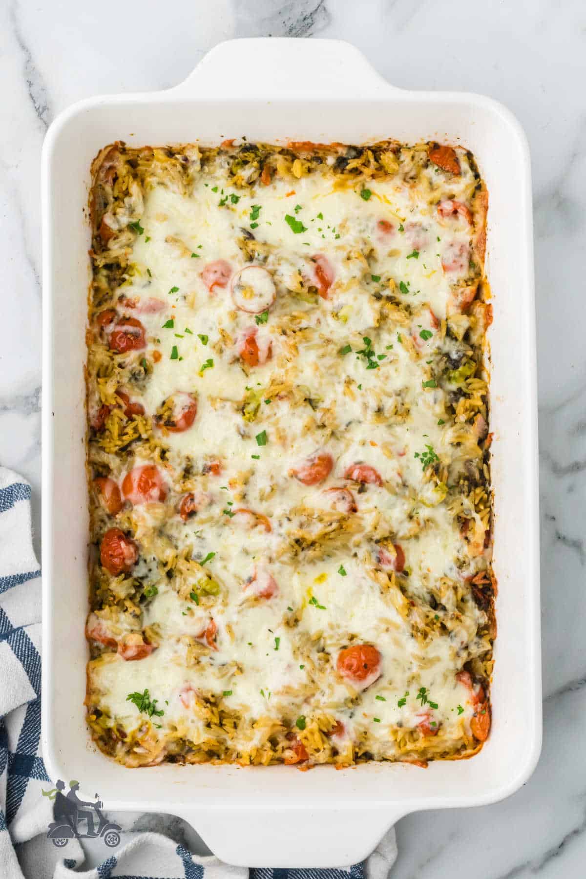 Easy one-pan caprese pesto orzo bake for a quick weeknight dinner.