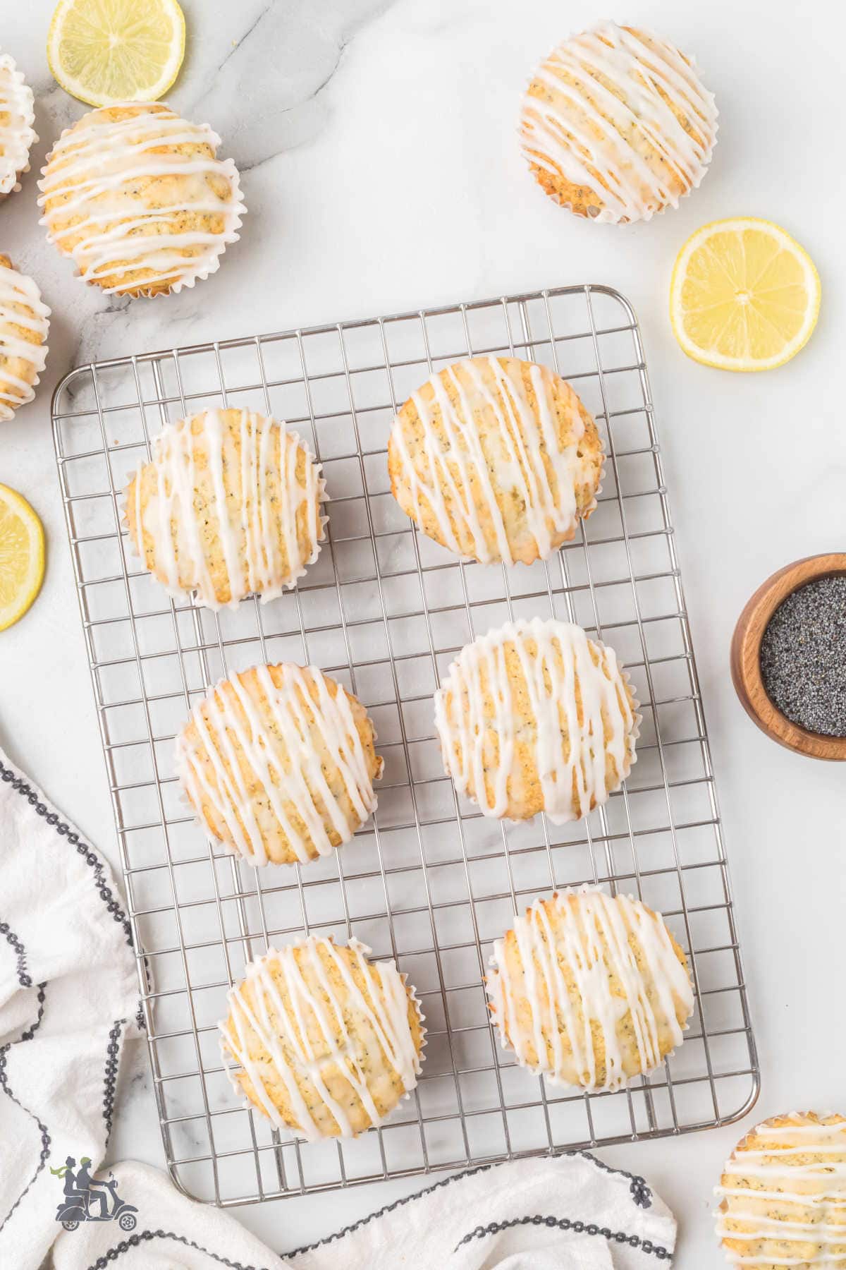 Lemon Poppy Seed Muffins with Lemon Glaze on a Wire Rack ready to be enjoyed.