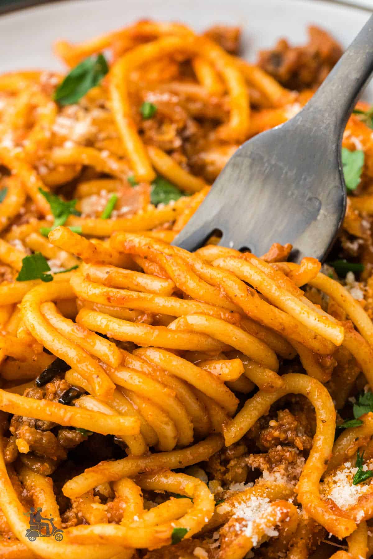 Close up of a fork twirling pasta strands on its tines. This is the easy budget one-pot spaghetti meal for the family.