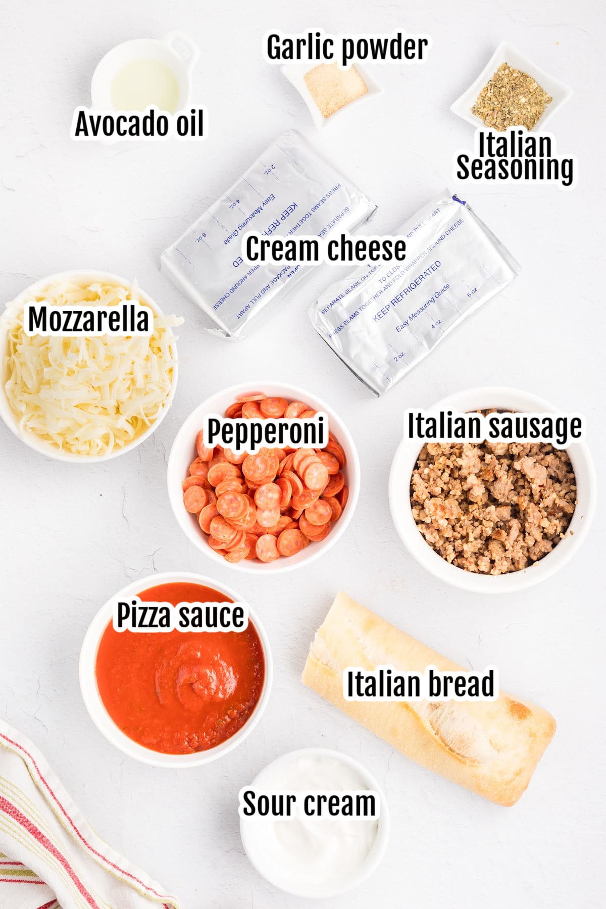 Ingredients needed to make the sausage pepperoni pizza dip.