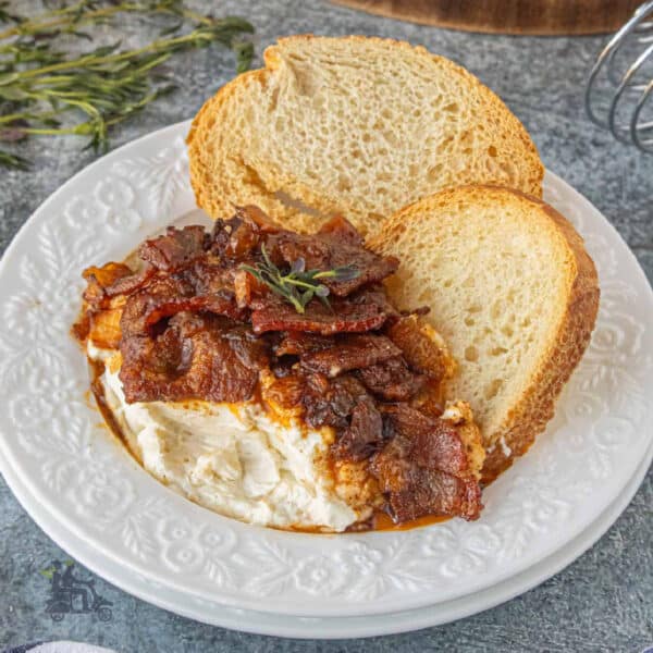 Whipped Goat Cheese with Smoky Bacon Jam served with homemade crostini.