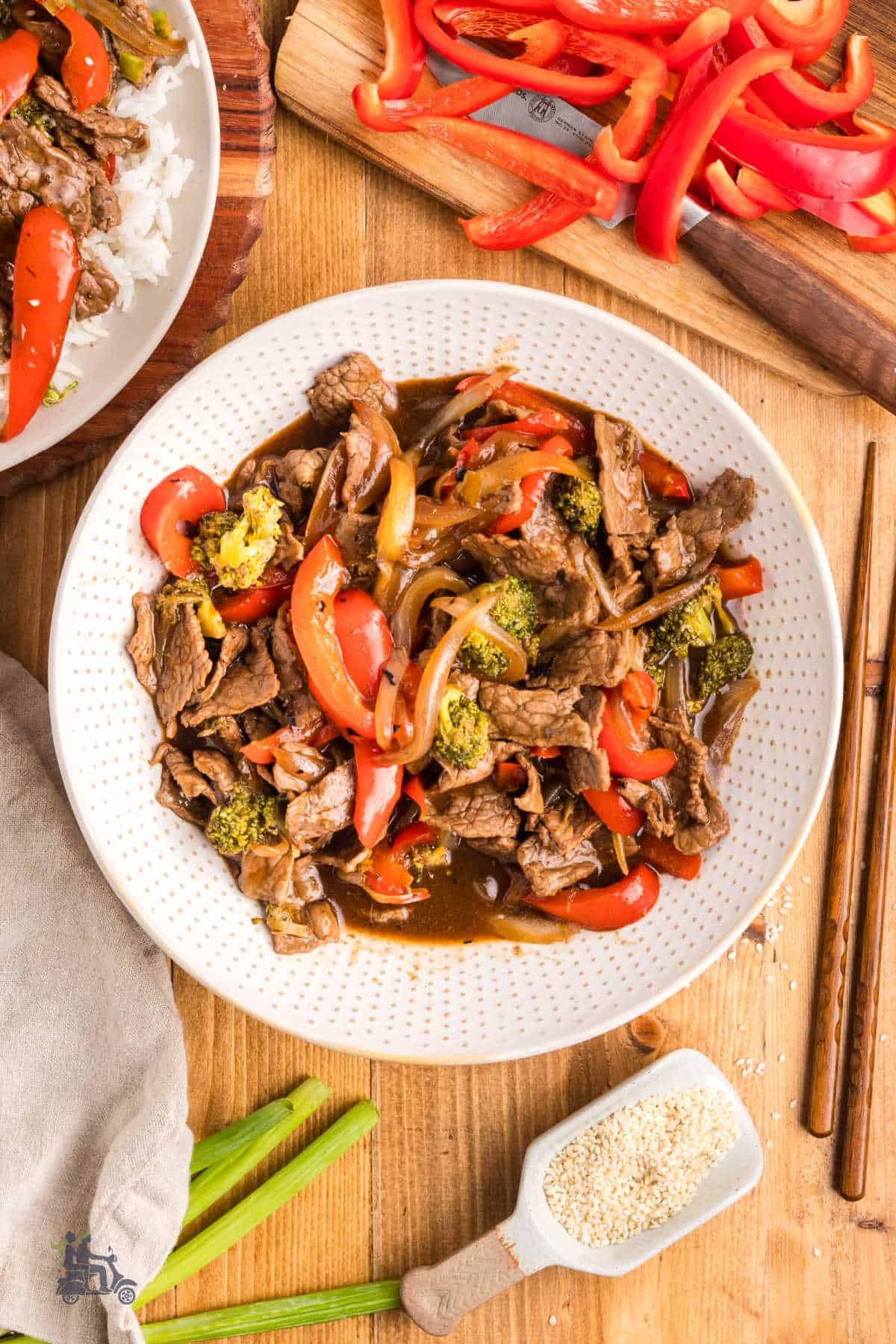 Easy 20 minute beef stir fry recipe with colorful vegetables and teriyaki glaze served in a white bowl.