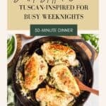 Creamy Stuffed Chicken breasts in a black skillet with a wooden spoon lifting a breast.