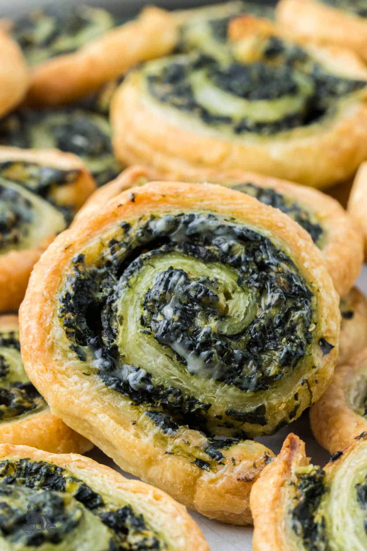 Crispy puff pastry swirls filled with creamy spinach mixture.