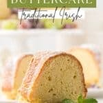 Easy Irish Butter Cake made in a bundt pan and sliced on a dessert plate with sugared grapes.