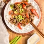 Long Pinterest Pin featuring how to make teriyaki beef and broccoli.