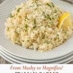 Italian baked rice served on a plate with a lemon wedge garnish as a simple side dish.