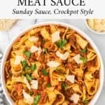 Sunday sauce Bolognese made in a slow cooker for easy cooking and served over pappardelle pasta with parmesan cheese.