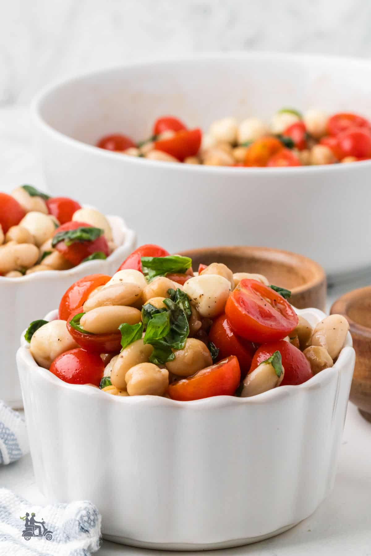 Individual bowls of Caprese Bean Salad served as a light vegetarian lunch.