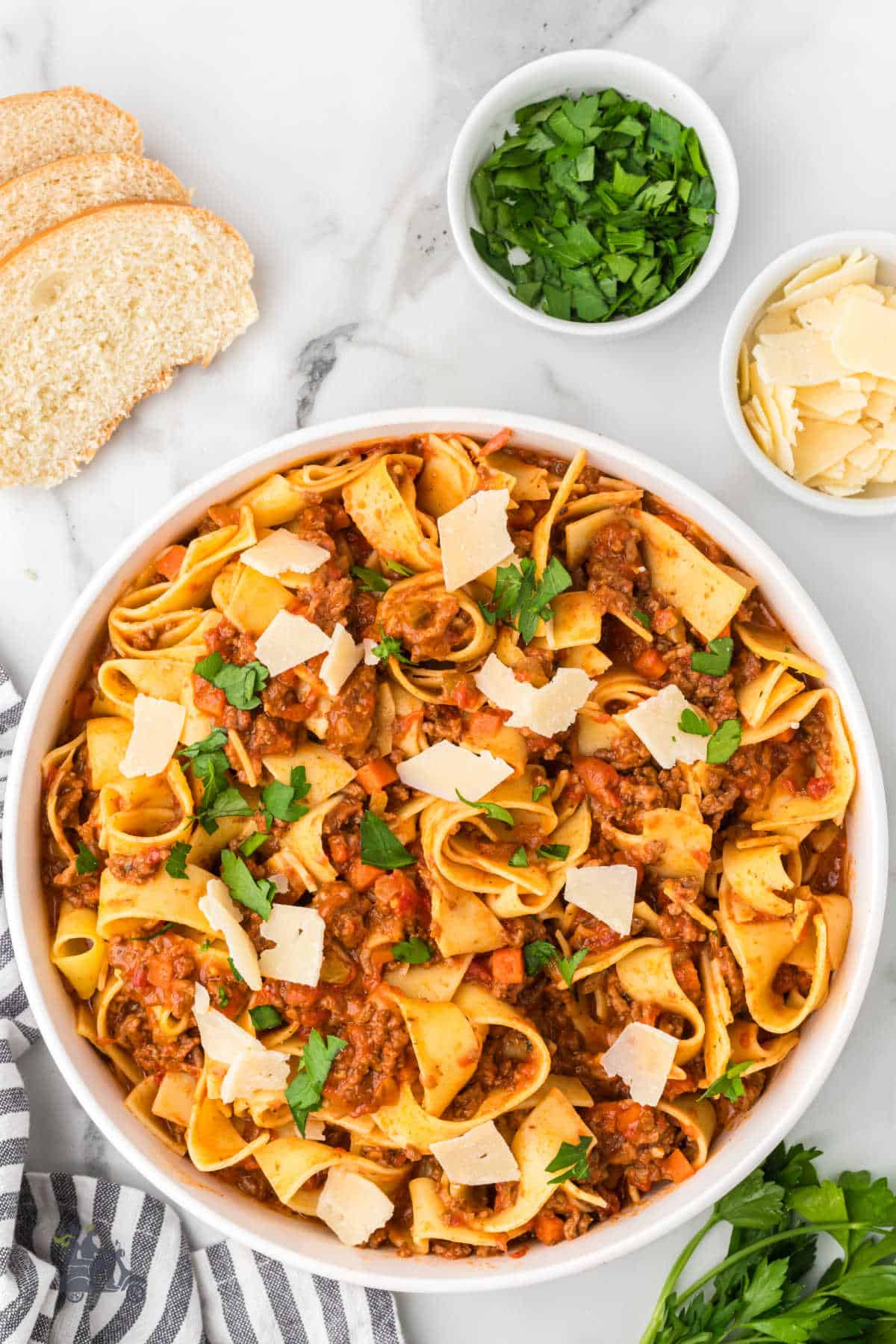 Wide ribbons of pappardelle, coated in a creamy beef Bolognese.Finished with flat-leaf parsley and a shower of Parmigiano-Reggiano.