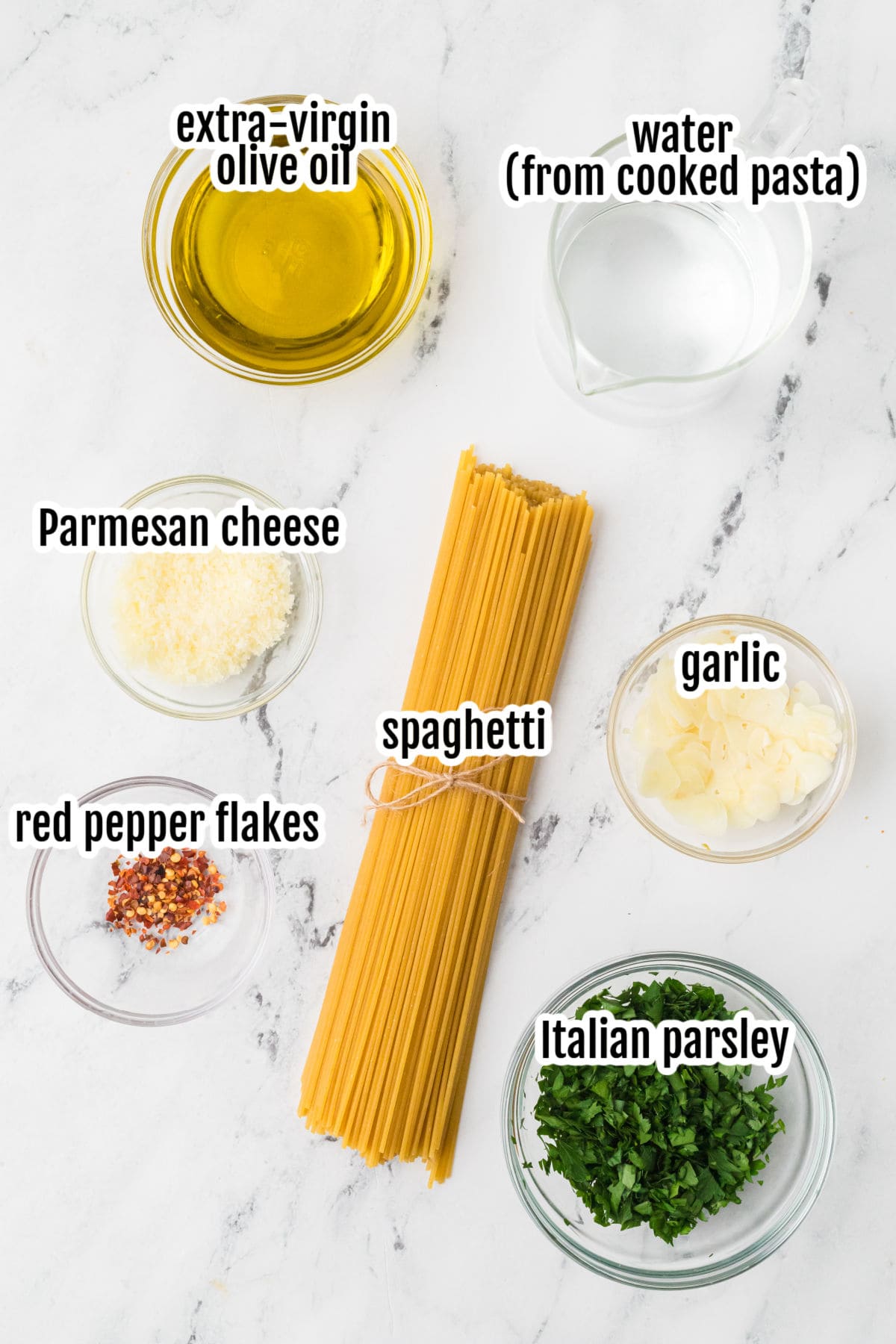 Image of the ingredients needed to make the quick and easy traditional Italian Spaghetti dish with garlic, olive oil, and red pepper flakes.
