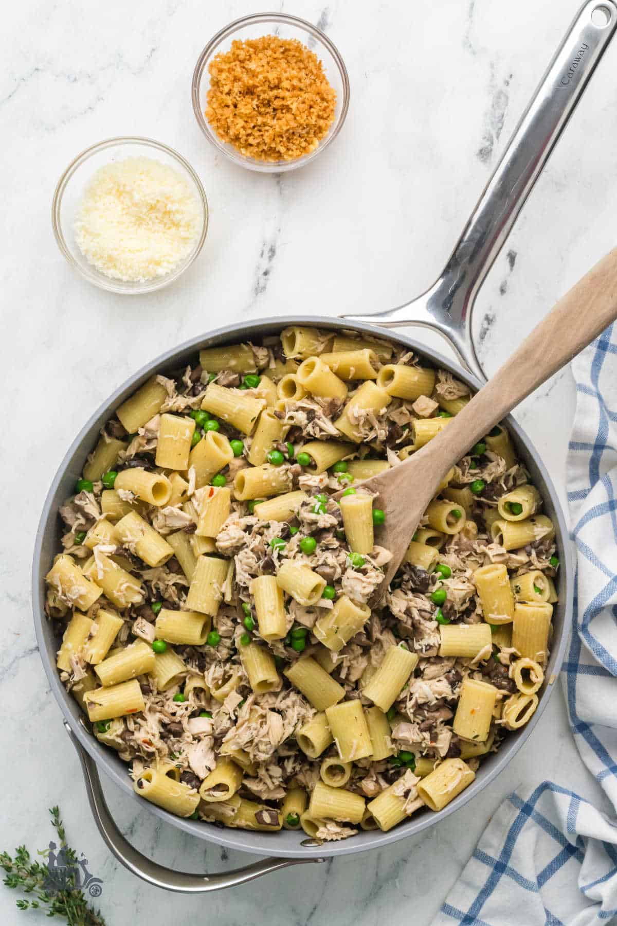 Chicken mushroom pasta with Parmesan cream sauce in a skillet.