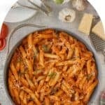 Large braiser filled with penne pasta tossed in creamy vodka sauce.