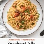 Family-friendly pasta dinner on a white and brown plate featuring tuna, mushrooms, and tomatoes.