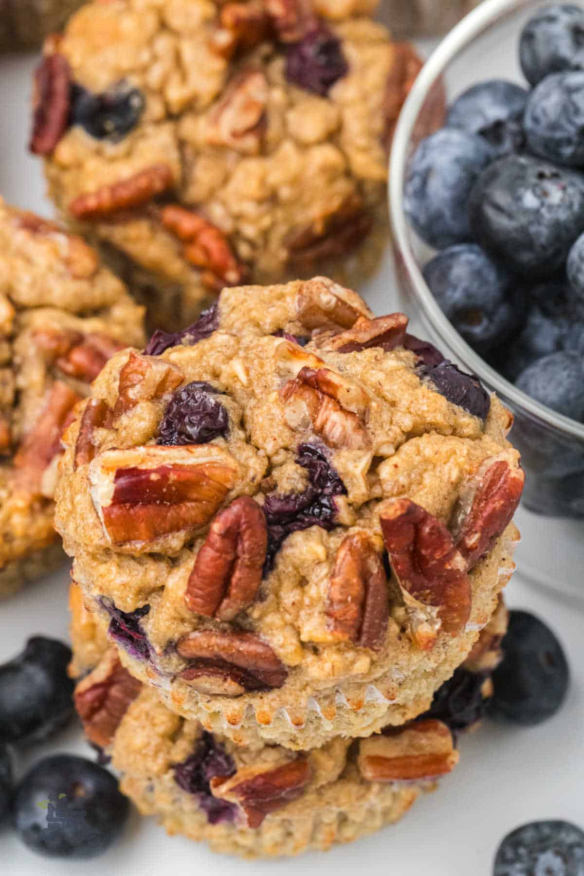Overhead view of the crunchy pecan topped blueberry banana flourless muffins.