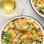 Creamy mushroom chicken pasta with peas then sprinkled with seasoned panko crumbs.